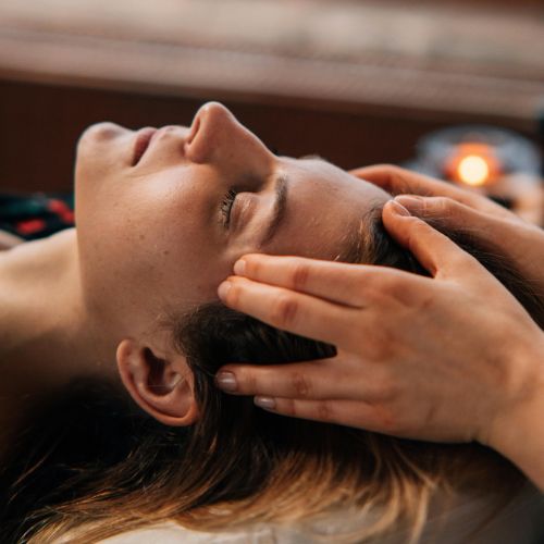 Close up of hands on head during Access Bars session